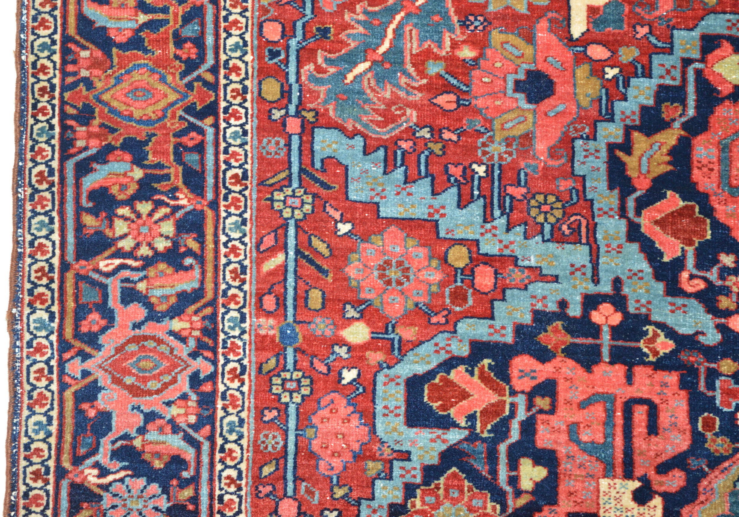 Field and border from a finely woven antique northwest Persian Heriz rug with a navy blue, Bakshaish style medallion on a red field framed by a navy blue Turtle design border, circa 1900. Douglas Stock Gallery offers a wide selection of high quality antique Persian Heriz, "Serapi", Karaja and Bakshaish rugs and room size carpets from the Heriz district in northwest Persia. Antique rugs Boston,MA area, antique rugs NYC by appointment, antique rugs DC by appointment