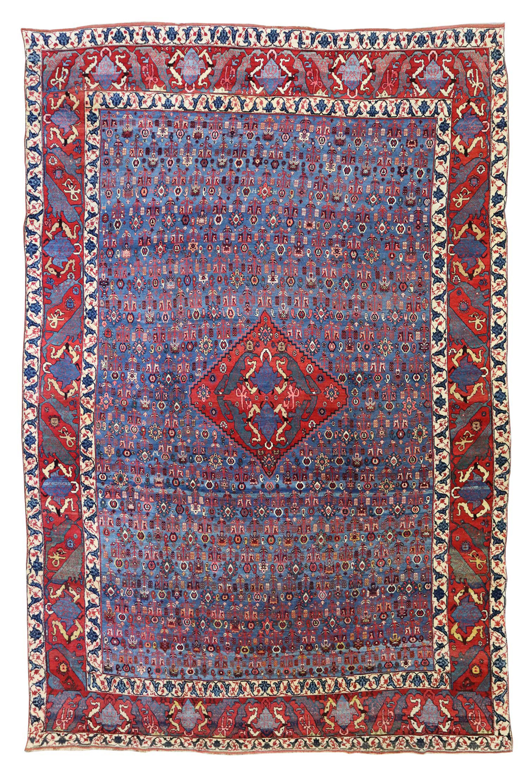 An early antique Bidjar carpet, northwest Persia, circa 1890, of the "Gerus" type featuring an uncommon design of small, stylized flowers on a mid blue field. Douglas Stock Gallery, antique rugs Bston,MA area South Natick,MA