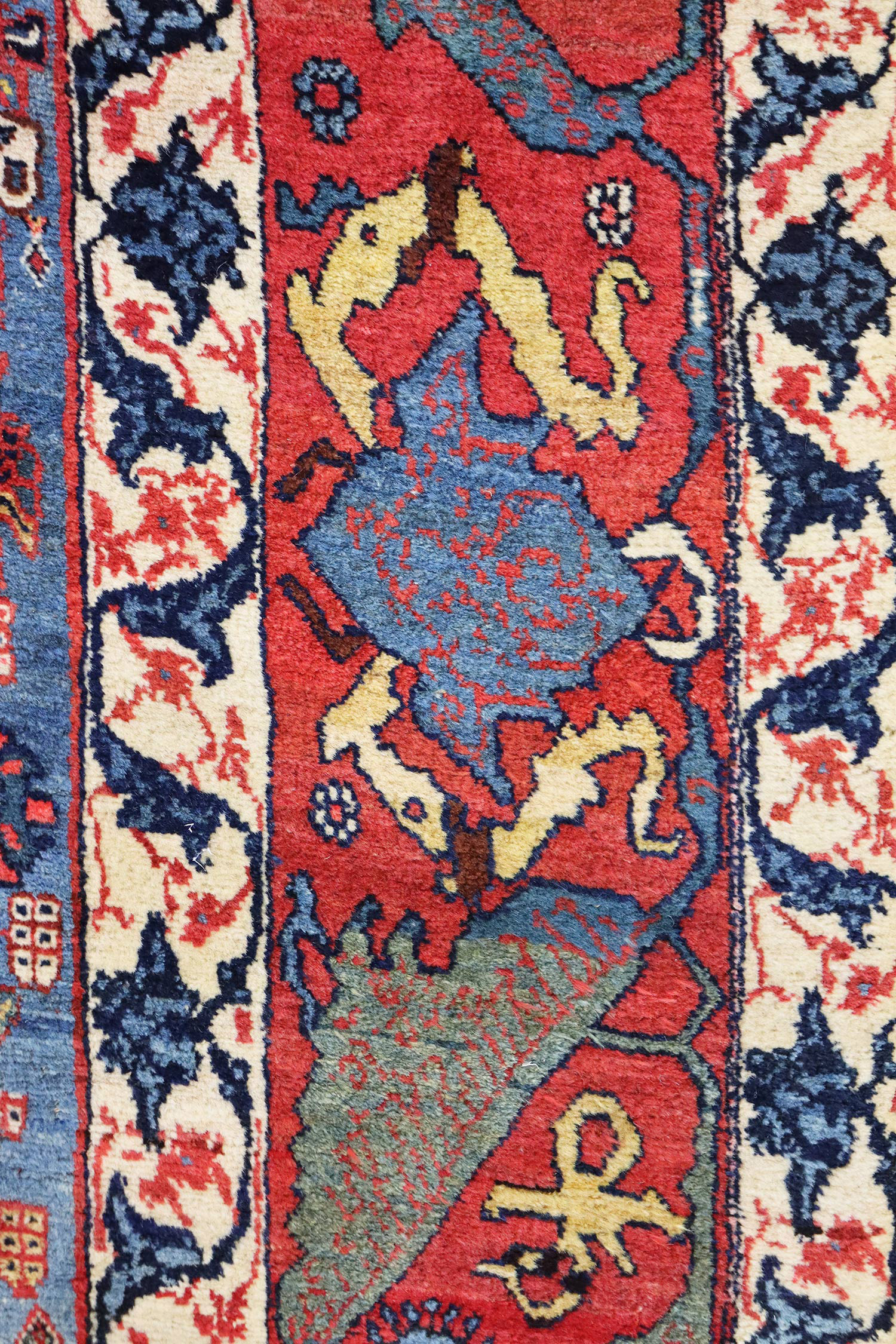 Border detail from an antique Persian Bidjar carpet in the "Gerus" style, circa 1890. The field features an uncommon design of small, stylized flowers on a mid blue field. Douglas stock Gallery, antique rugs Wellesley / Natick,MA area