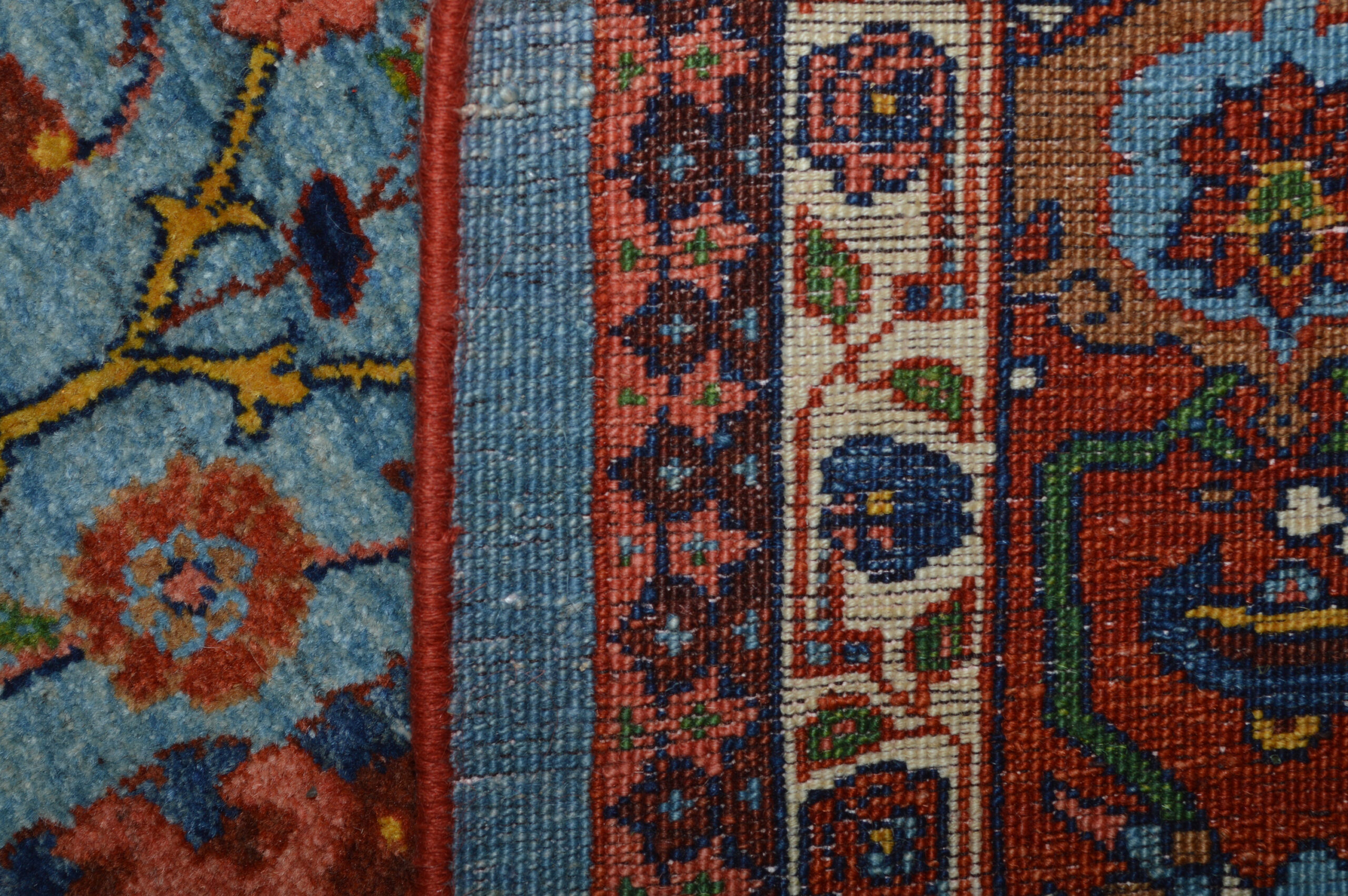 Close-up photo of the weave of a new, finely woven Bidjar rug with design based on classical period "Vase" design rugs. This photos shows the Reciprocal Trefoil outer minor border. Douglas Stock Gallery, contemporary hand woven Oriental rugs Boston,MA area
