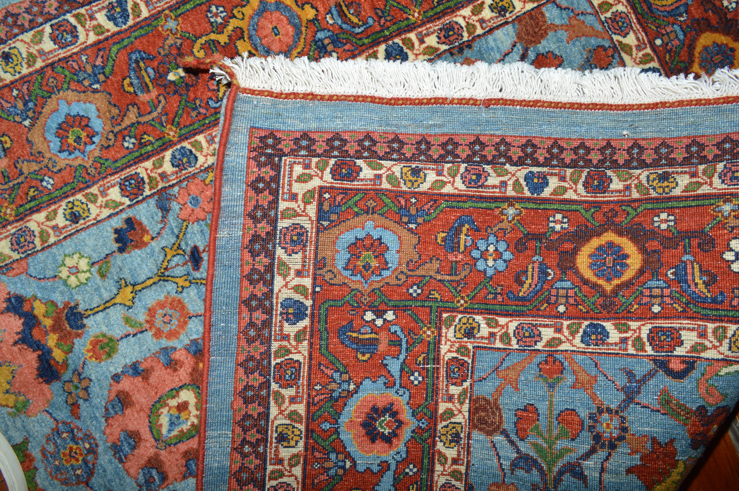 Weave detail of a fine, new Bidjar rug with a classical "Vase" design on a steep sky blue field that is framed by a brick red "Turtle" border. Douglas Stock Gallery, new Oriental rugs Boston,MA area