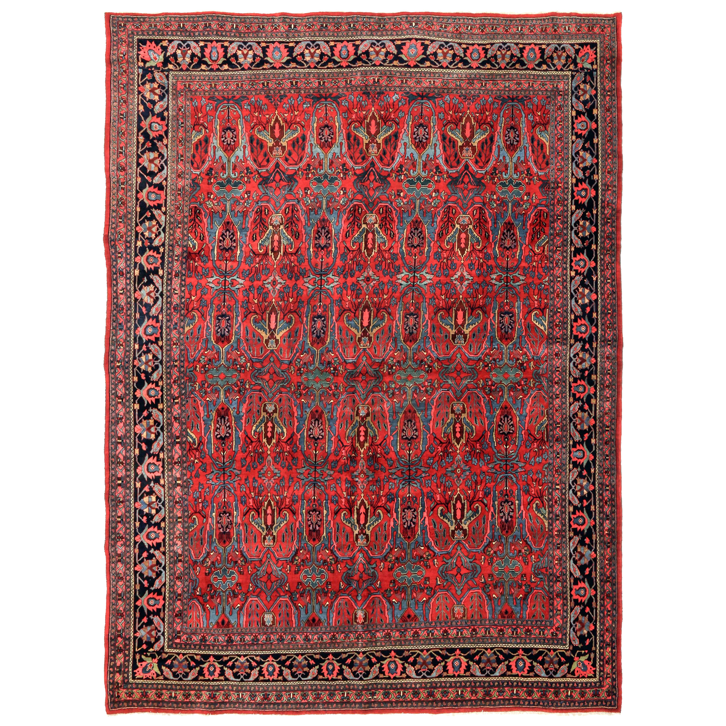 An antique Bidjar carpet with the Calyx design on a red field that is framed by a navy border, northwest Persia, circa 1910 - Douglas Stock Gallery specializes in antique Persian Bidjar rugs and carpets and other northwest Persian Kurdish rugs including senneh rugs and Kurdish nomadic rugs and bags. Antique Bidjar rugs, antique Persian Bidjar carpets
