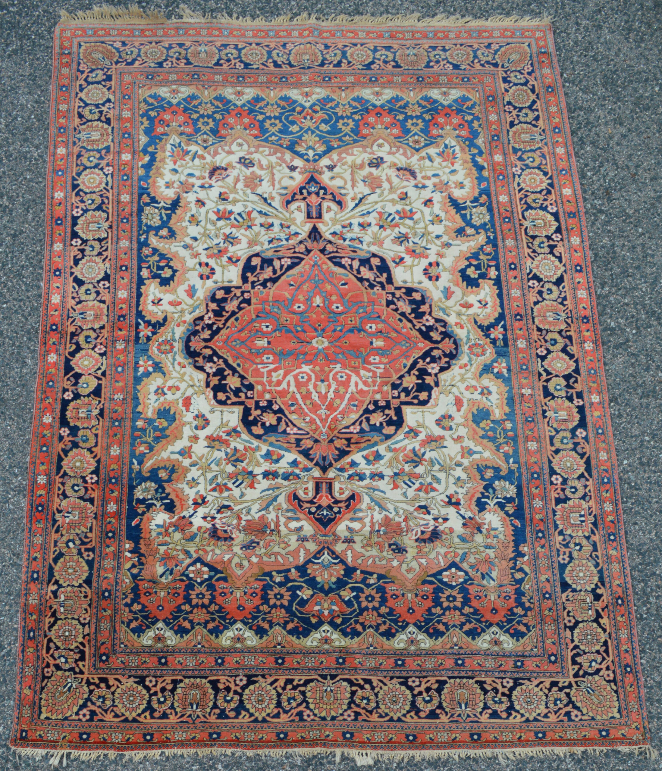 Boston,MA area based Douglas Stock Gallery specializes in 19th century antique Persian Mohtasham Kashan rugs and room size Mohtasham Kashan carpets. This Mohtasham Kashan rug has a soft red and navy blue medallion on an ivory field that is framed by mid blue trim and a navy blue border, circa 1880.