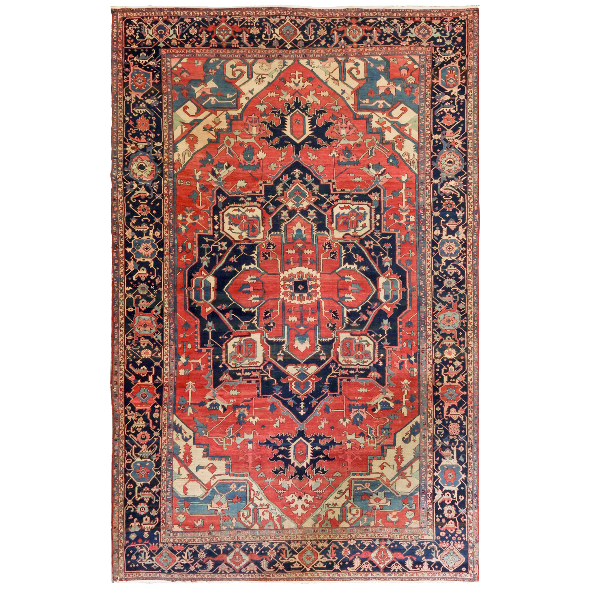 Over size antique Persian Heriz "Serapi" carpet with a navy medallion on a salmon color field that is framed by ivory corner spandrels and a navy blue border, northwest Persia, circa 1890