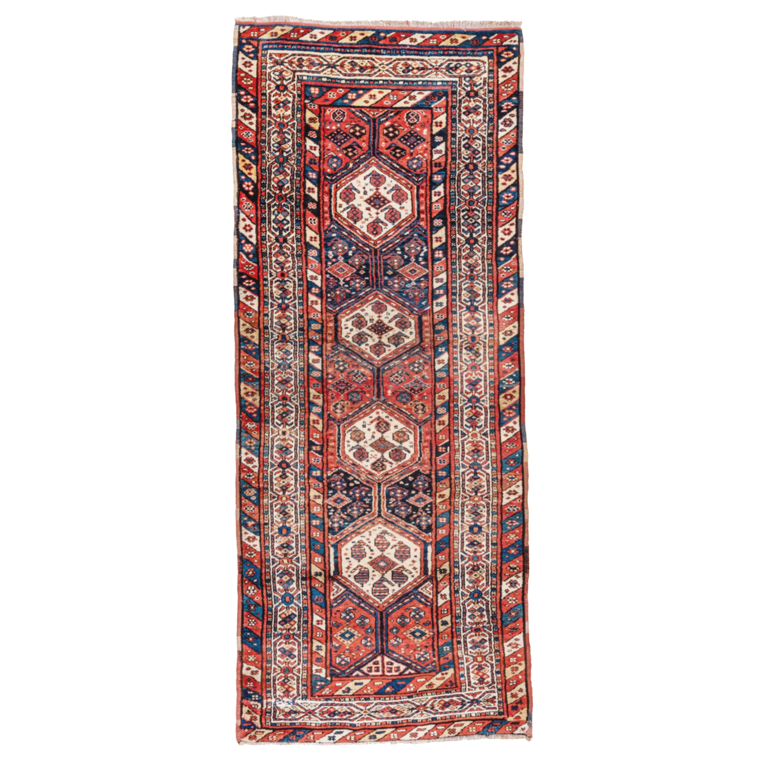 An antique Persian tribal rug, probably woven by the Luri tribe. Brick red and navy panels combine with ivory medallions to decorate the field that is framed by an ivory border with diagonally striped guard border, circa 1900. Douglas Stock Gallery is a Boston area dealer in antique Oriental rugs offering a selection of antique tribal rugs by QashQa'i, Kurdish, Afshar, Luri and Bakhtiari people