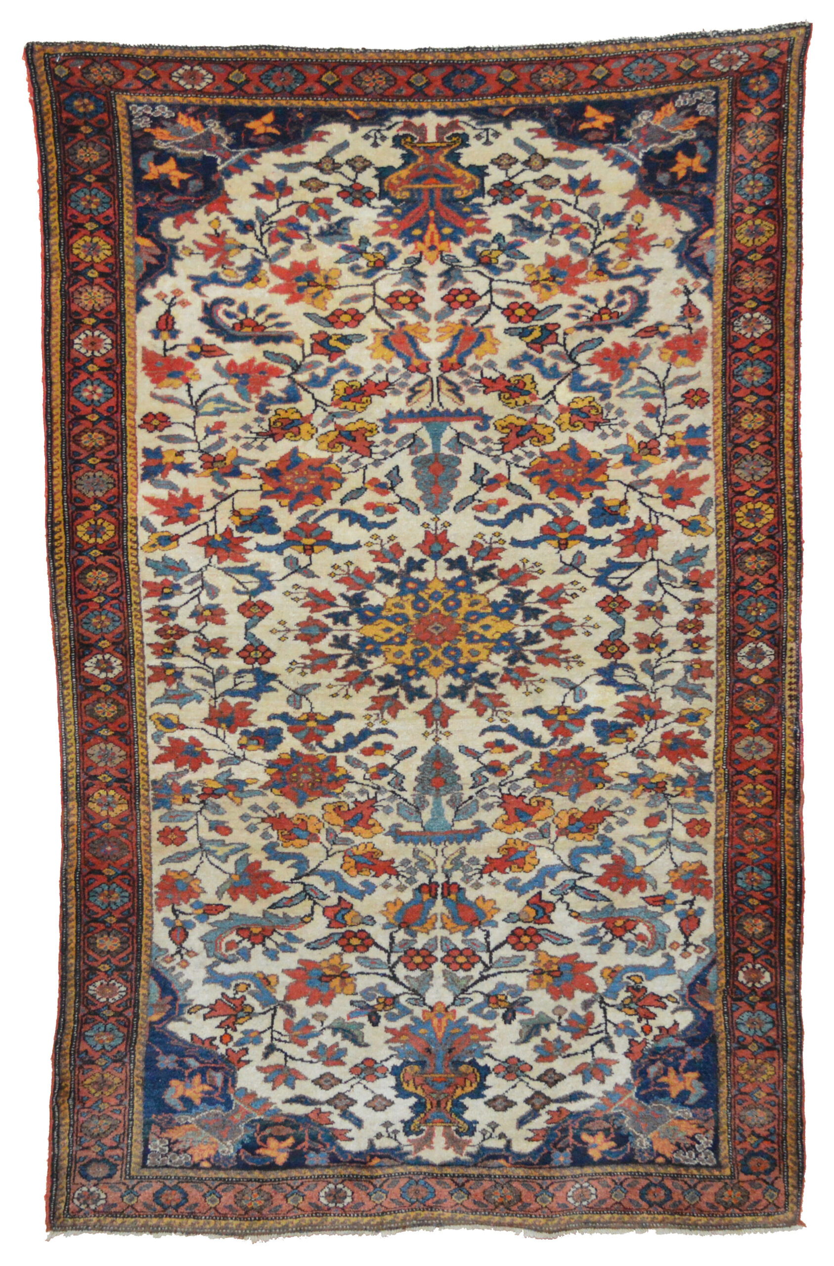 An antique south Persian tribal Bakhtiari rug with a floral design on an ivory field that is framed by a red border, south Persia, circa 1920. Douglas Stock Gallery, antique rugs New England