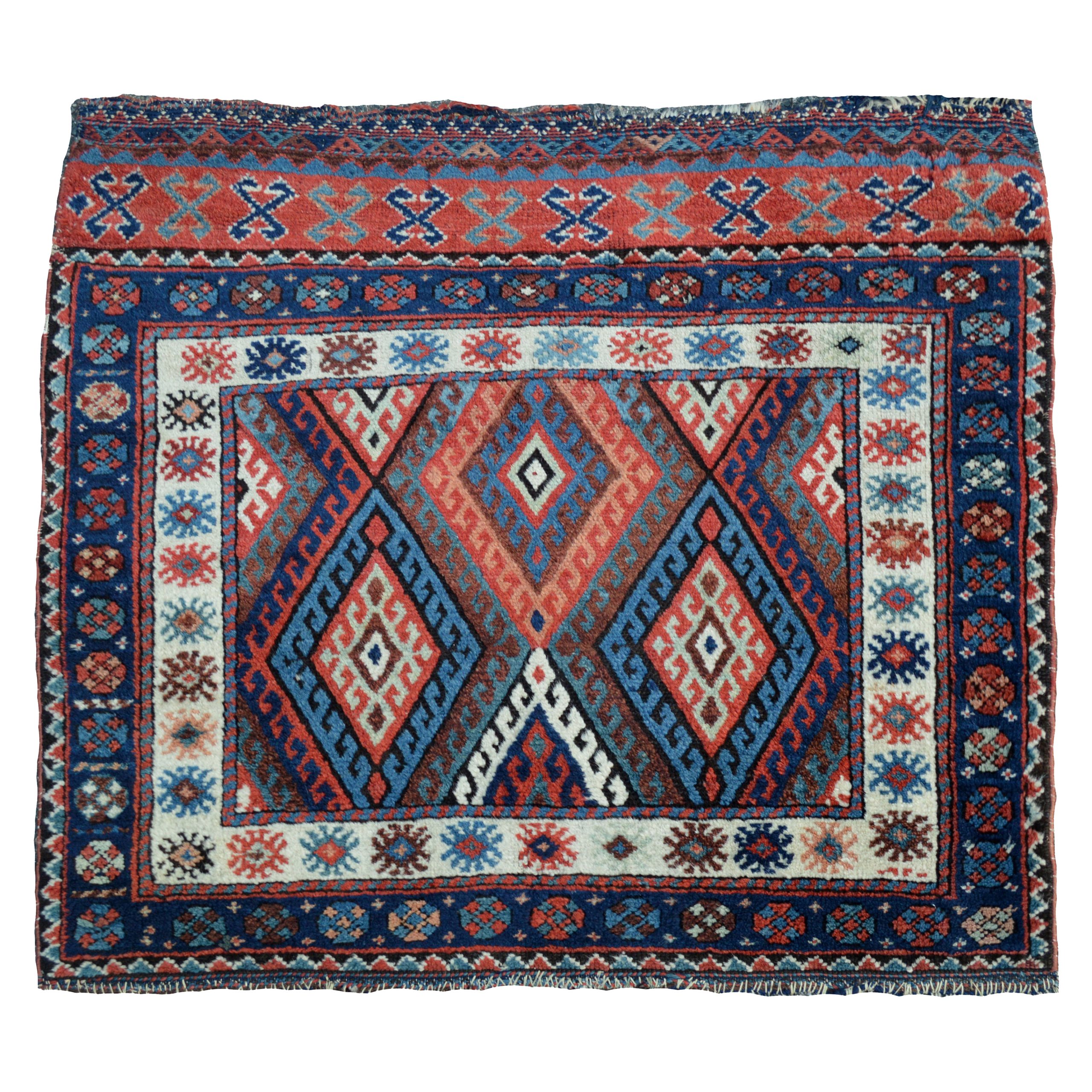 An exceptional antique Jaff Kurdish bag face of large size with a large scale version of the classic diamond design and superb colors, northwest Persia, circa 1890. Douglas Stock Gallery specializes in antique Persian Kurdish bags, rugs and runners, antique rugs Boston,MA area New England, antique Kurdish bags New York by appointment