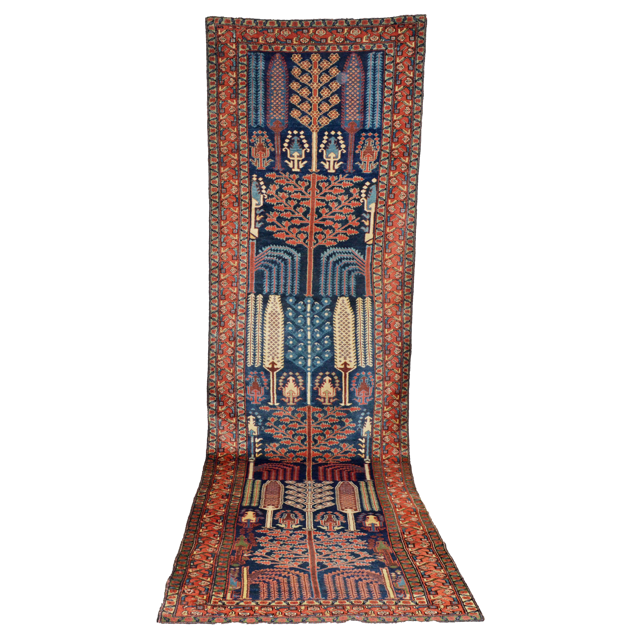 An antique Bakhtiari runner rug featuring the famous "Bid Majnun" design of Cypress and Willow trees on a navy field that is framed by a brick red border with green guard border, south Persia, circa 1910. Douglas Stock Gallery, antique Persian runner rugs, antique Oriental runners, antique runners Boston,MA area, antique Persian tribal rugs