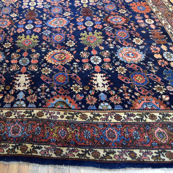 Antique Persian Bidjar carpet with the Harshang design on a navy blue field that is framed by a rose color "Turtle" design border, northwest Persia, circa 1900. Douglas Stock Gallery antique Oriental rugs Boston,MA area New England, antique rugs New York by appointment, antique rugs Washington DC, Maryland, Virginia area by appointment