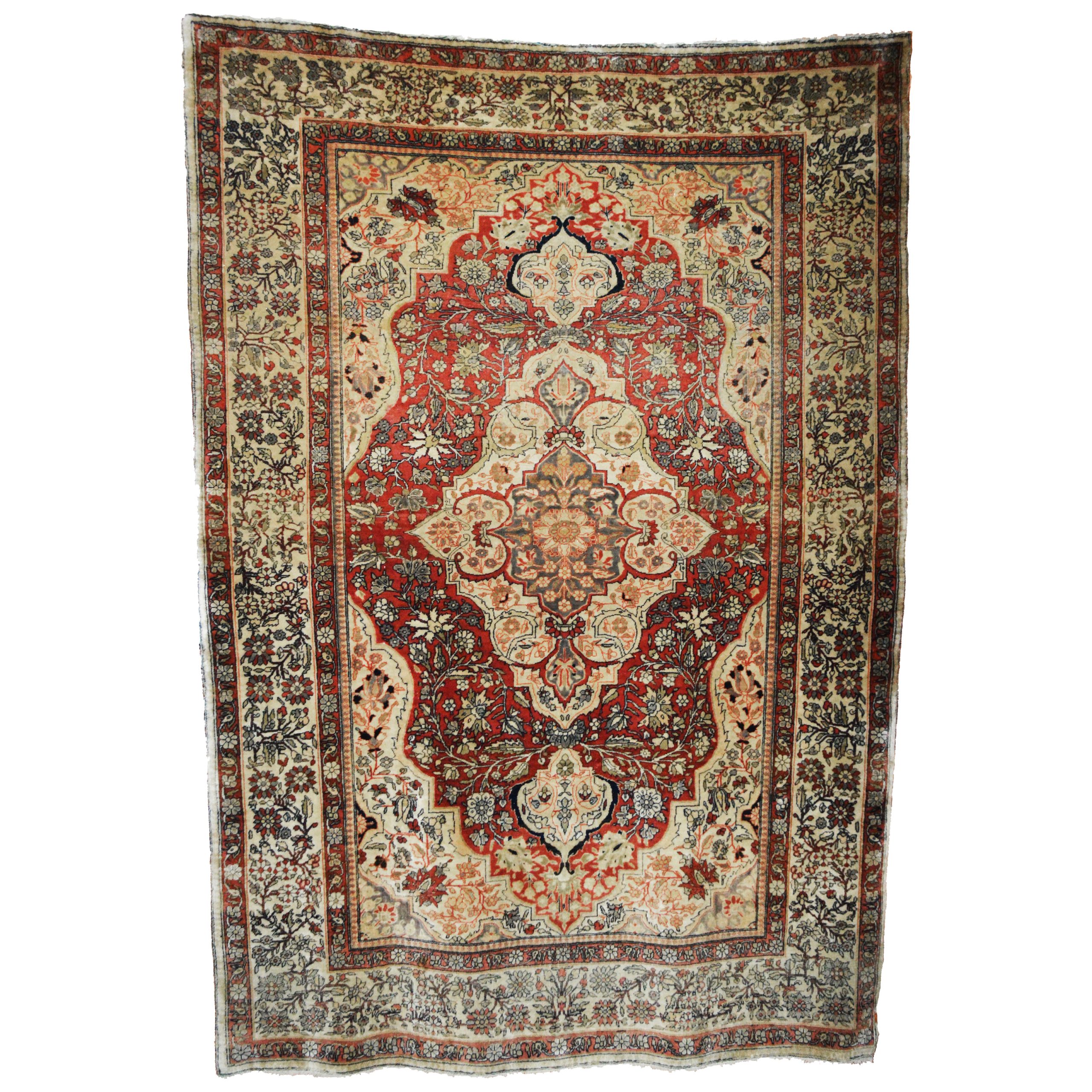 A fine late 19th century Persian Mohtasham Kasha rug. The red field is decorated with an ivory medallion and stylized leaves, flowers and vines. Ivory corner spandrels and an uncommon ivory border frame the field. Central Persia, Circa 1895. Douglas Stock Gallery specializes in antique Mohtasham Kashan rugs. Antique Kashan rugs Boston,MA area New England, antique Kashan rugs NYC by appointment, antique Kashan rugs Washington,DC area by appointment