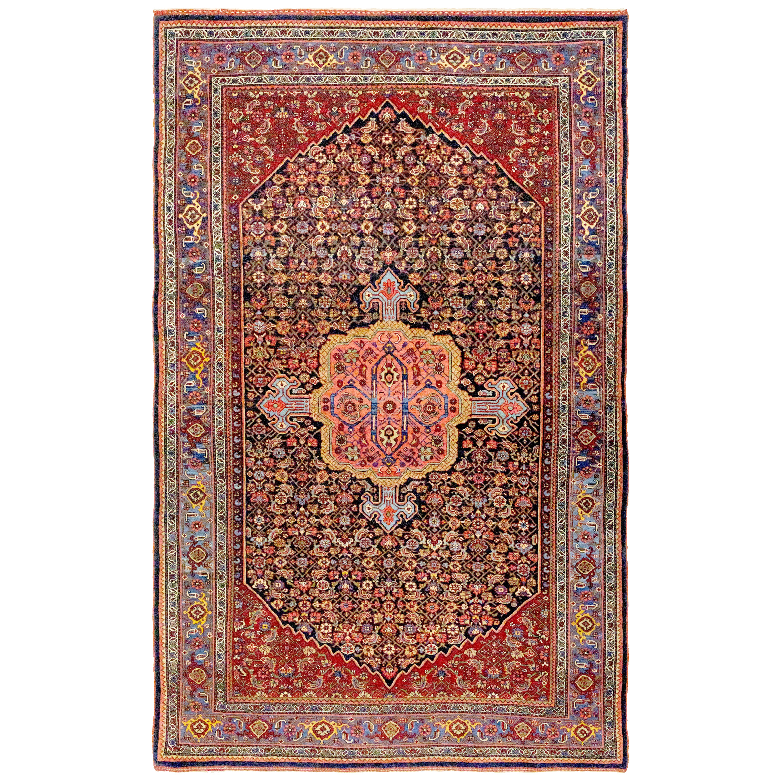 An antique Bidjar rug with a navy blue field decorated with the classical Herati design. A coral color medallion with sky blue pendants floats on the field which is framed by brick red corner spandrels and a mid blue border with "Turtle" palettes. Northwest Persia, circa 1925. Douglas Stock Gallery is one of America's leading specialist dealers in antique Bidjar rugs.